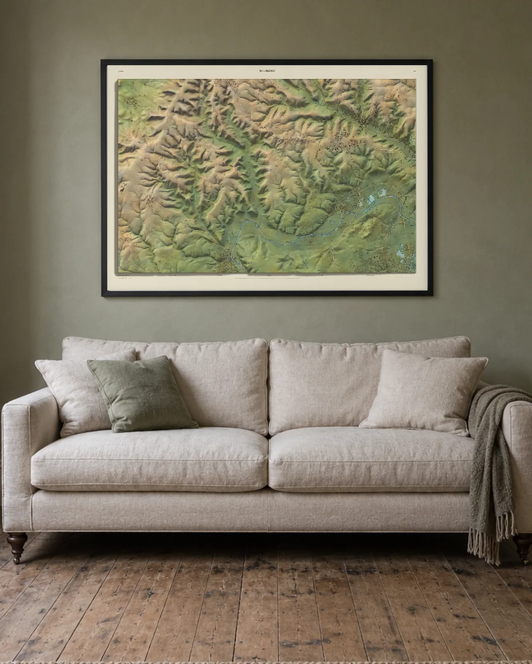 A Field and Fell map of the Chilterns, A0 in a black frame, hanging above a three-seat sofa in an illustrated sitting room